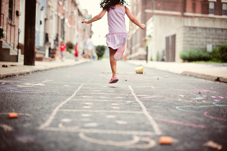 Little girl playing hopskotch in South Philadelphia